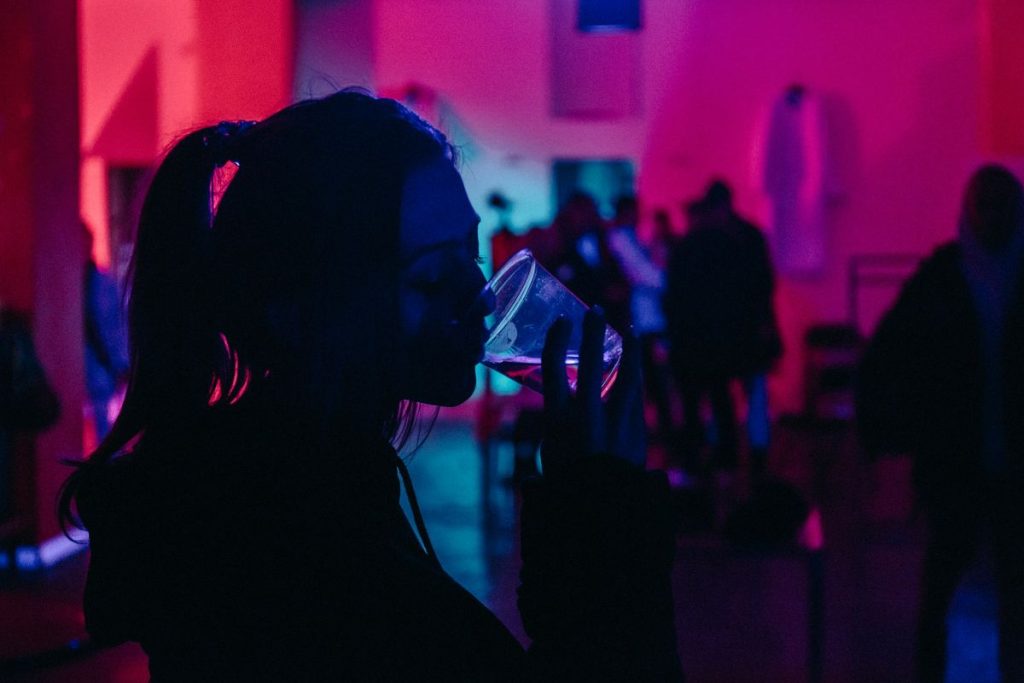 woman drinking in an event